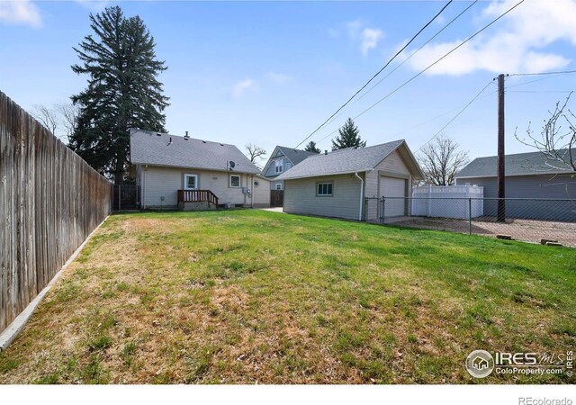 405 Maple St, Fort Morgan, CO 80701 - view of yard with a garage and an outdoor structure