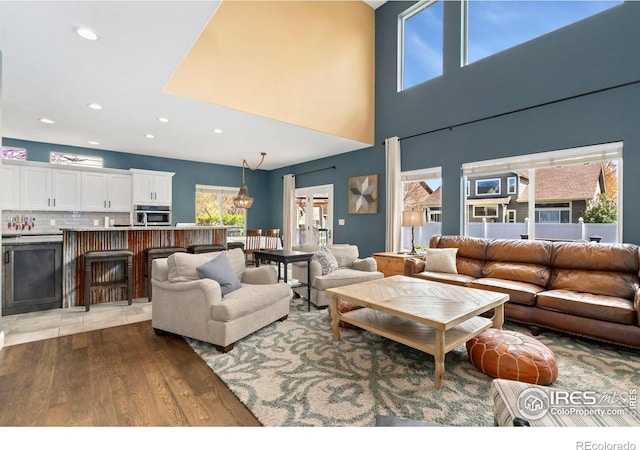 living area featuring recessed lighting and wood finished floors