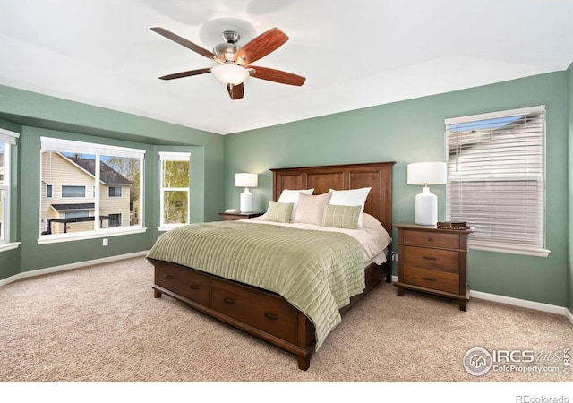 bedroom with baseboards, light colored carpet, and ceiling fan