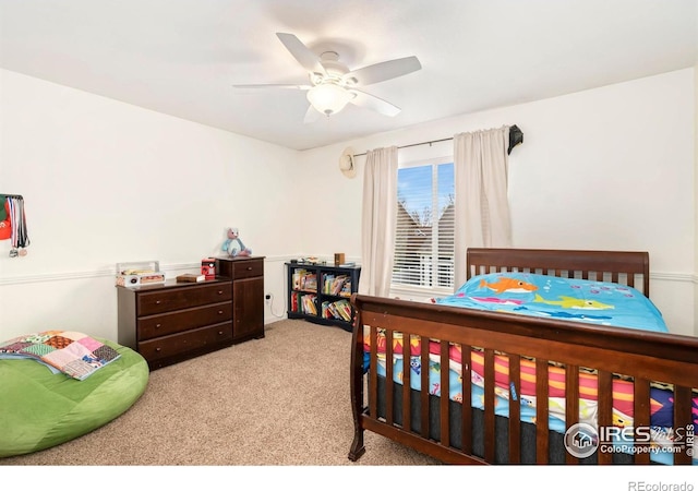 carpeted bedroom with ceiling fan