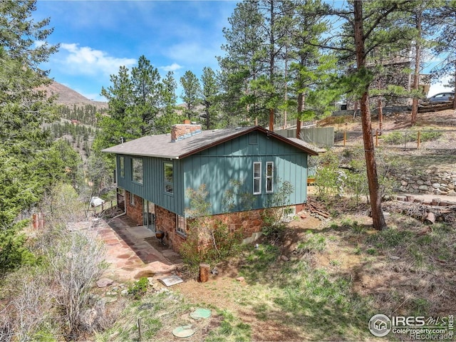 4 Porphyry Vw, Jamestown, CO 80455 - view of home's exterior with a chimney and roof with shingles