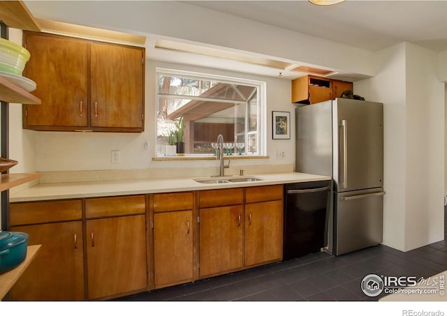 4 Porphyry Vw, Jamestown, CO 80455 - kitchen with a sink, black dishwasher, freestanding refrigerator, dark tile patterned floors, and light countertops