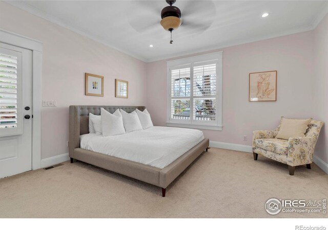 bedroom with visible vents, carpet flooring, and baseboards