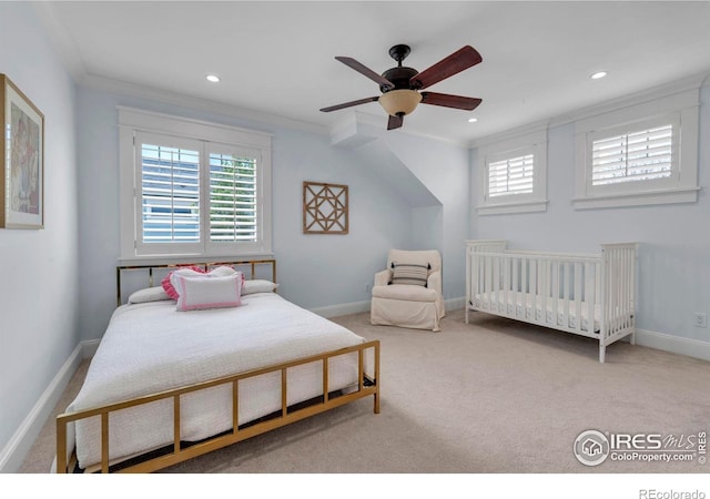 bedroom featuring baseboards, carpet, and multiple windows