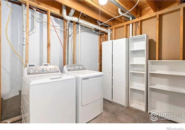 clothes washing area with washer and dryer and laundry area