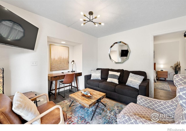 living area featuring a chandelier and wood finished floors