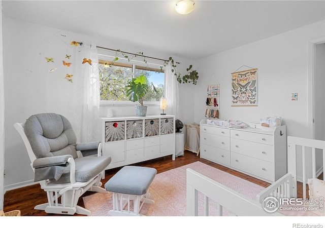 bedroom with wood finished floors