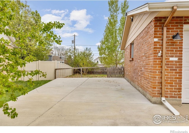 view of patio featuring fence