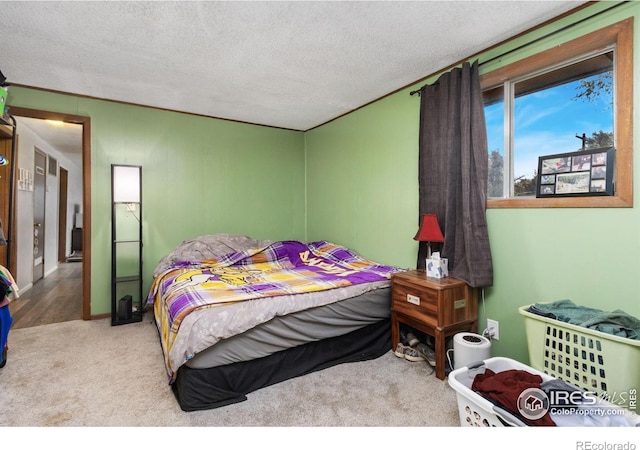 carpeted bedroom featuring a textured ceiling