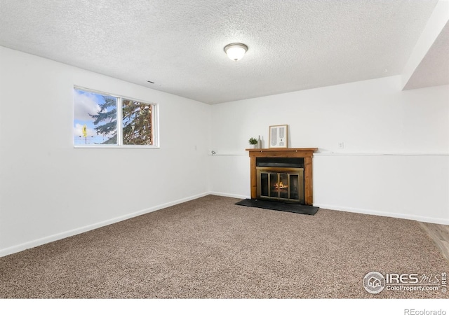 713 Boltz Dr, Fort Collins, CO 80525 - unfurnished living room with a glass covered fireplace, baseboards, carpet, and a textured ceiling