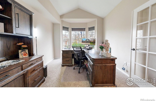 1442 Mallard Dr, Johnstown, CO 80534 - home office with light colored carpet, vaulted ceiling, and baseboards