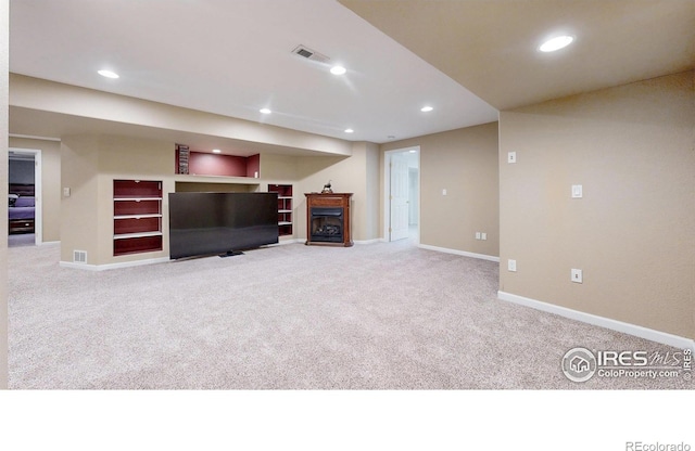 1442 Mallard Dr, Johnstown, CO 80534 - unfurnished living room featuring carpet flooring, a fireplace, recessed lighting, and baseboards