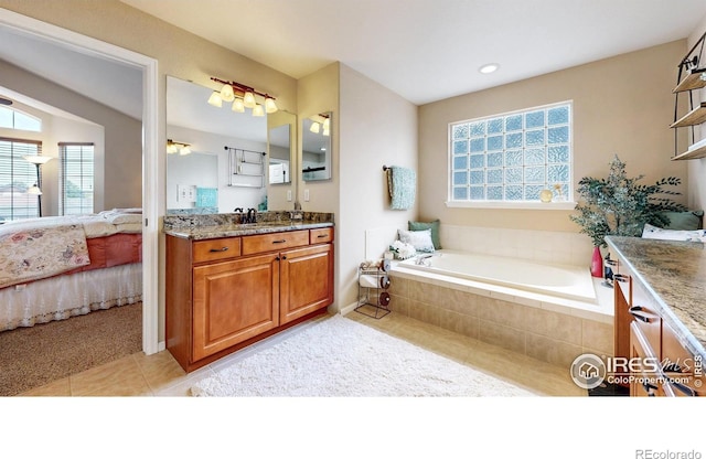 1442 Mallard Dr, Johnstown, CO 80534 - full bath featuring connected bathroom, tile patterned floors, a garden tub, vanity, and recessed lighting
