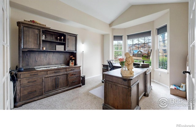1442 Mallard Dr, Johnstown, CO 80534 - office featuring light carpet, lofted ceiling, and baseboards