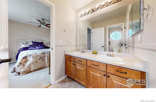 1442 Mallard Dr, Johnstown, CO 80534 - bathroom featuring ceiling fan, ensuite bathroom, and double vanity