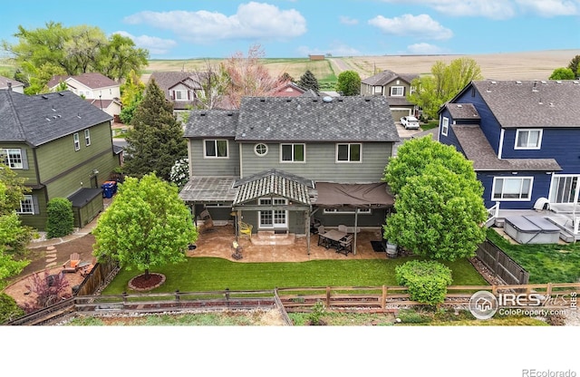 1442 Mallard Dr, Johnstown, CO 80534 - rear view of property featuring a residential view, a patio area, and roof with shingles