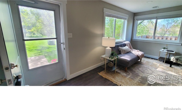 1180 Monroe Dr Unit C, Boulder, CO 80303 - sitting room with baseboards and dark wood-style flooring