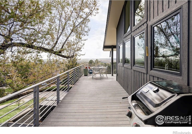 wooden deck with outdoor dining area