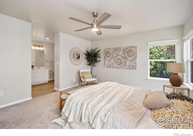 carpeted bedroom featuring baseboards, ceiling fan, and connected bathroom