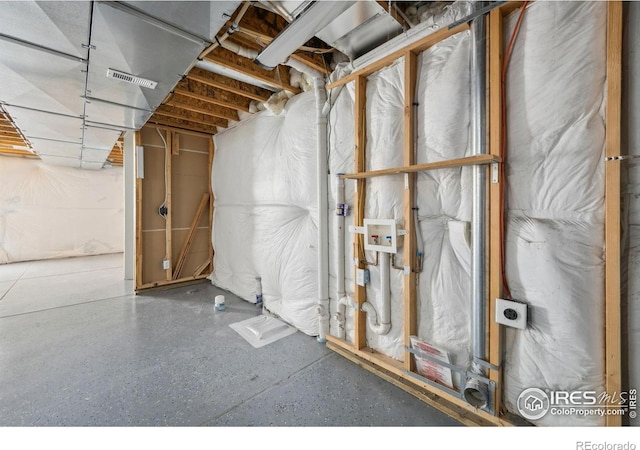 unfinished basement featuring visible vents