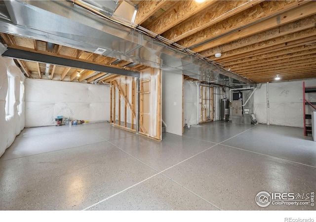 unfinished basement with water heater