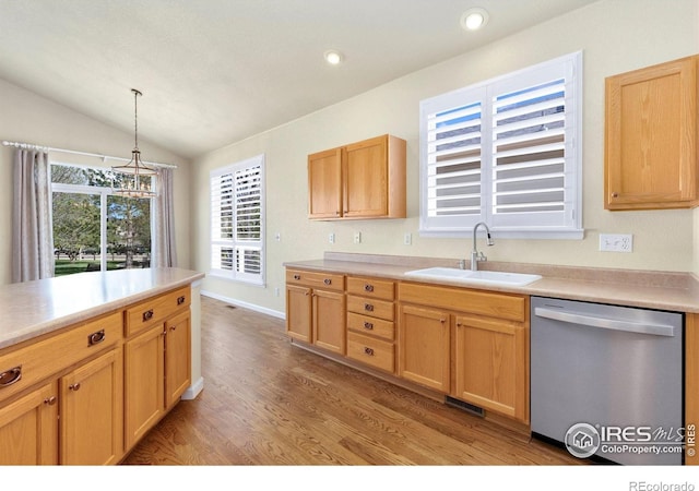 kitchen featuring visible vents, a sink, light wood finished floors, dishwasher, and vaulted ceiling
