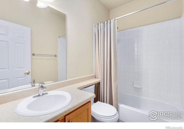 full bath featuring vanity, shower / tub combo, and toilet
