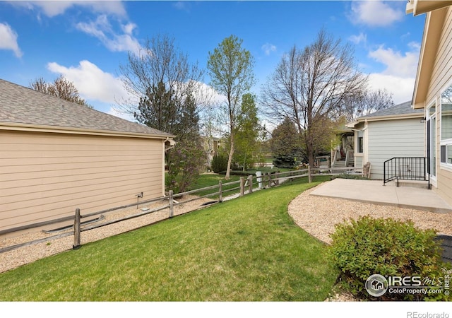 view of yard with a patio area and fence