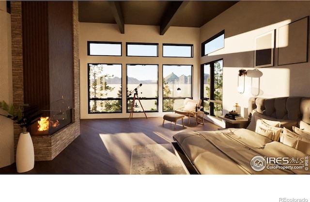 living room with wood finished floors, a towering ceiling, beam ceiling, and a fireplace