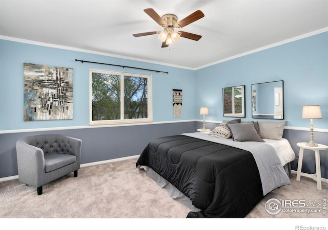 carpeted bedroom with baseboards, ornamental molding, and ceiling fan