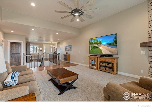 1603 Plank Ln, Fort Collins, CO 80524 - carpeted living area featuring arched walkways, baseboards, recessed lighting, and a ceiling fan