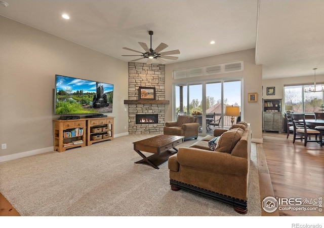 1603 Plank Ln, Fort Collins, CO 80524 - living room featuring a stone fireplace, recessed lighting, baseboards, and ceiling fan
