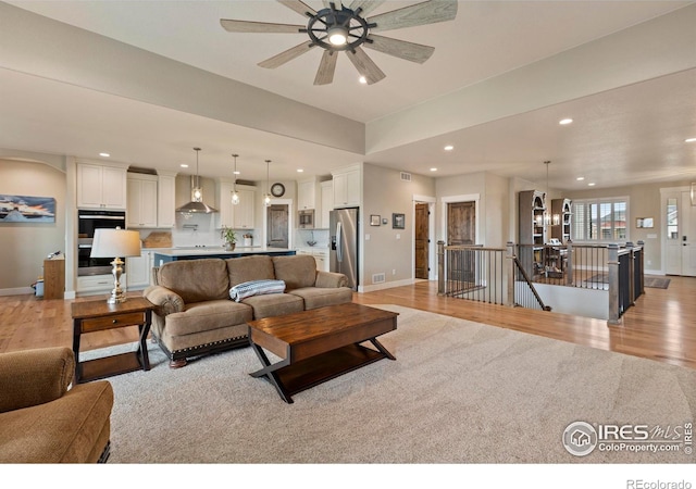1603 Plank Ln, Fort Collins, CO 80524 - living area featuring light wood-style floors, baseboards, and recessed lighting