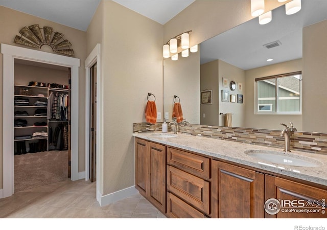 1603 Plank Ln, Fort Collins, CO 80524 - bathroom featuring a sink, tile patterned flooring, double vanity, and visible vents