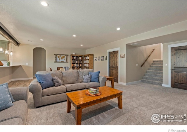 1603 Plank Ln, Fort Collins, CO 80524 - living area featuring recessed lighting, arched walkways, baseboards, and stairway