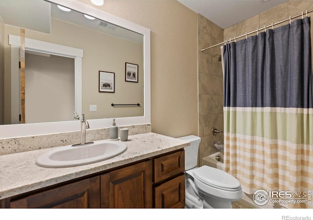 1603 Plank Ln, Fort Collins, CO 80524 - full bathroom with vanity, visible vents, a textured wall, toilet, and shower / bath combo