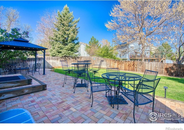 8574 W 94th Ave, Westminster, CO 80021 - view of patio / terrace with a fenced backyard, a gazebo, and outdoor dining area
