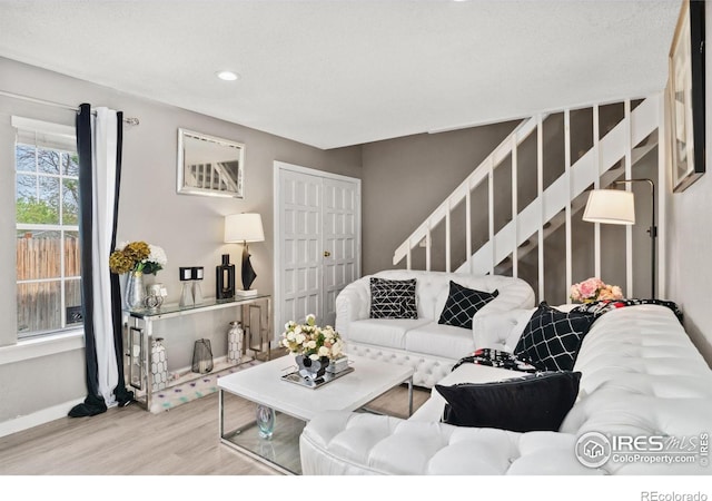 living room with stairway, baseboards, recessed lighting, and wood finished floors