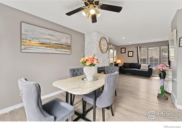 dining area with recessed lighting, ceiling fan, baseboards, and light wood-style floors