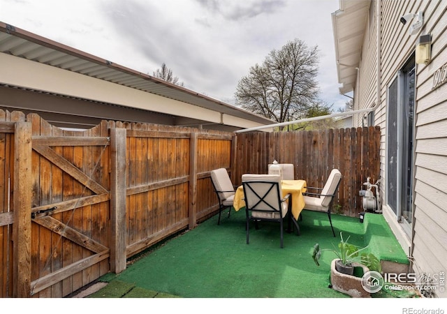 view of patio / terrace featuring fence and outdoor dining area