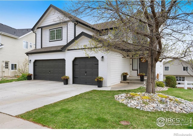 4400 Red Fox Ct, Loveland, CO 80537 - traditional-style home with brick siding, driveway, a front lawn, and a garage