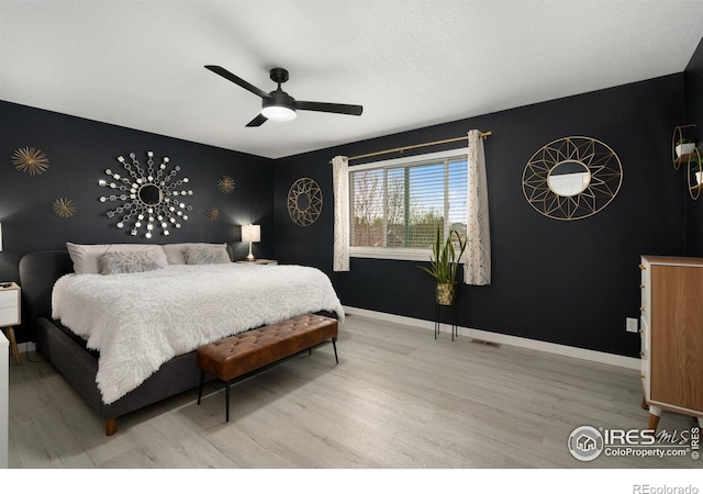 4400 Red Fox Ct, Loveland, CO 80537 - bedroom featuring baseboards, ceiling fan, wood finished floors, and visible vents