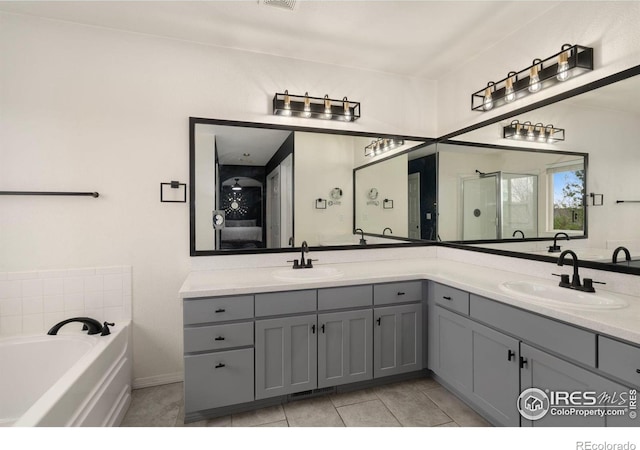 4400 Red Fox Ct, Loveland, CO 80537 - ensuite bathroom featuring double vanity, a shower stall, a sink, and ensuite bathroom