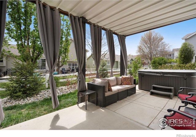 4400 Red Fox Ct, Loveland, CO 80537 - view of patio / terrace with a residential view, a hot tub, and an outdoor hangout area