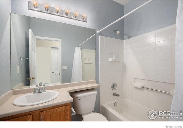 bathroom featuring vanity, toilet, and shower / tub combo
