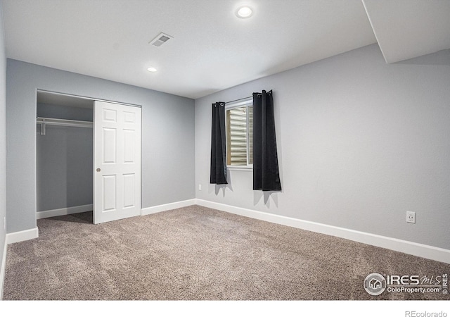 unfurnished bedroom with visible vents, recessed lighting, baseboards, and carpet floors