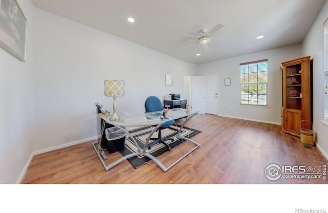 office with light wood-style floors, a ceiling fan, baseboards, and recessed lighting