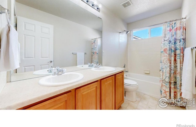bathroom featuring double vanity, shower / bathtub combination with curtain, and toilet