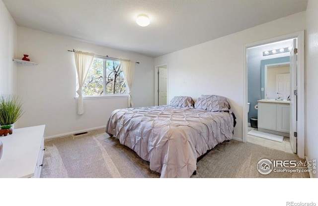 carpeted bedroom with baseboards