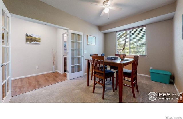 dining space with french doors, carpet, ceiling fan, and baseboards